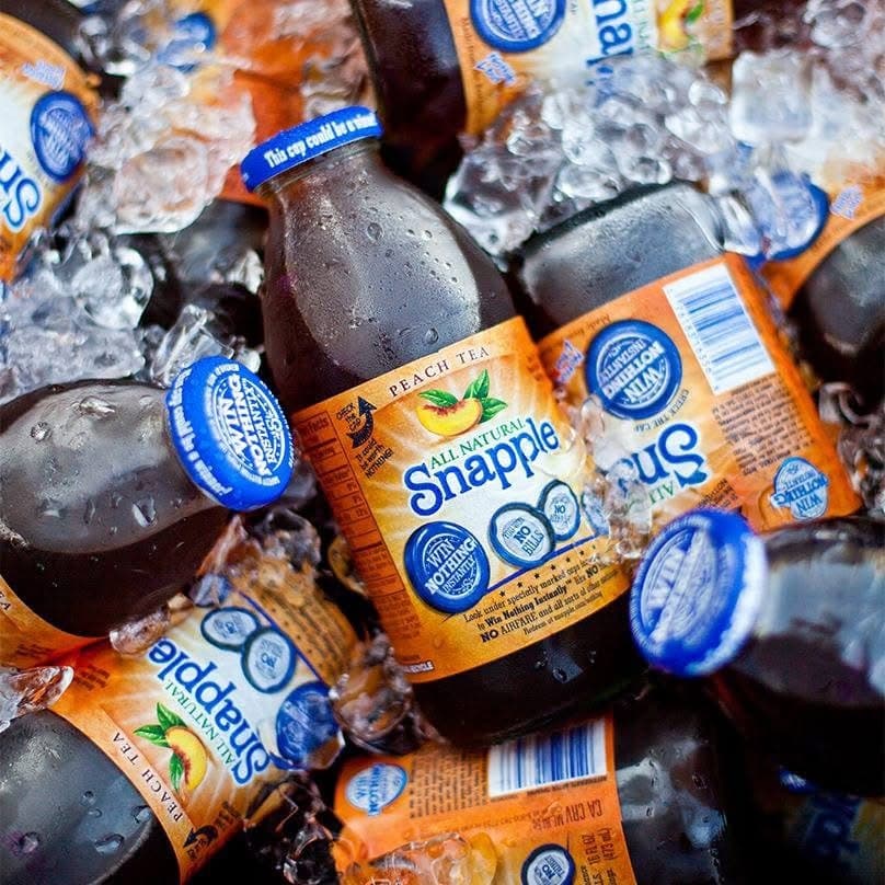 Cooler with Snapple Peach Tea bottles